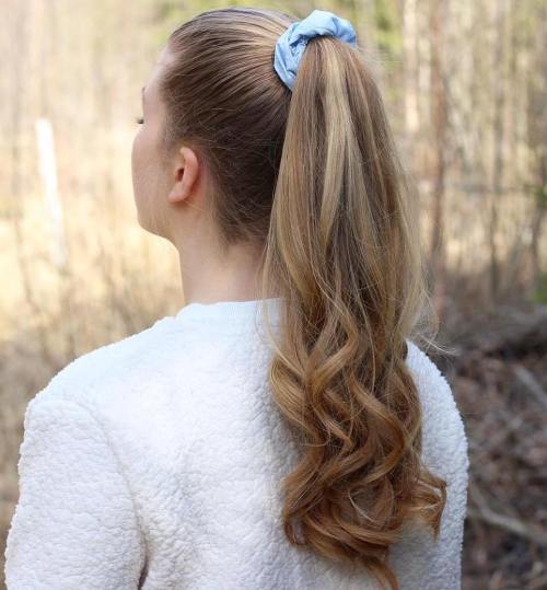 High ponytail with a scrunchie