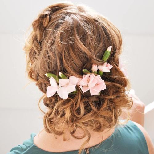 Braided curly updo with flowers