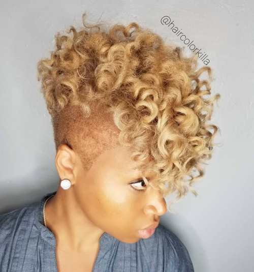 Curly blonde mohawk with shaved sides