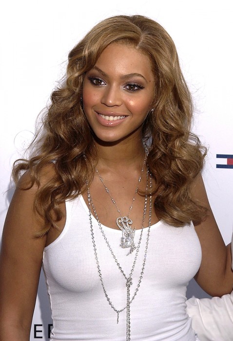 LIGHT BROWN WITH BIG CURLS AND A SIDE PART
