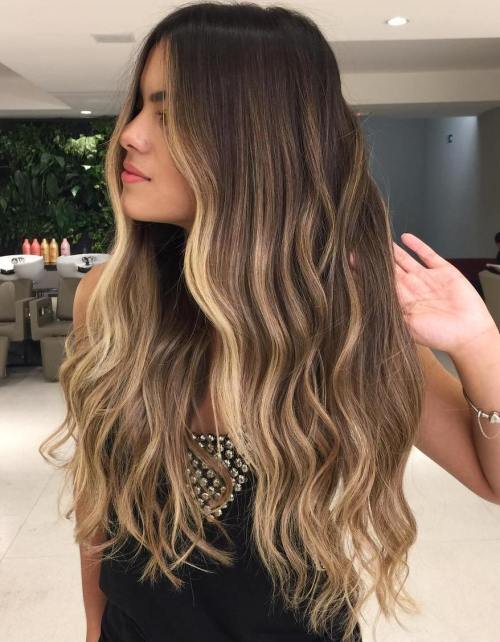 Long brown hair with blonde face framing highlights