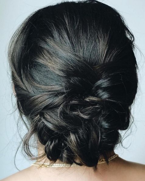 Low messy braided updo