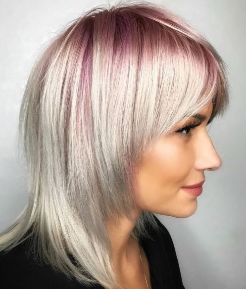 White blonde hairstyle with pastel pink roots