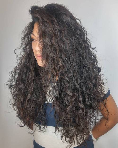 Long curly brunette hairstyle
