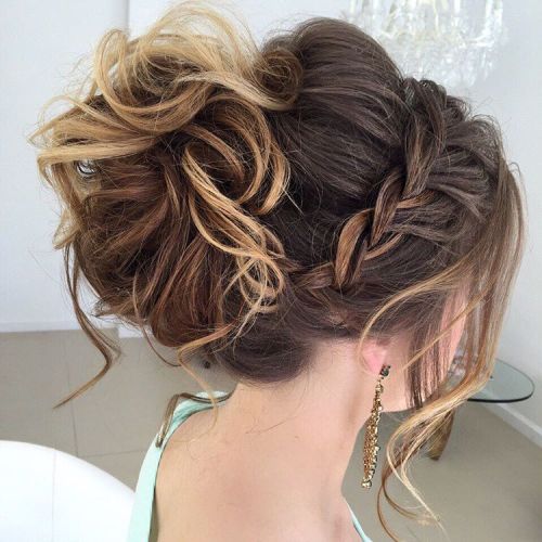 Messy curled updo with a braid
