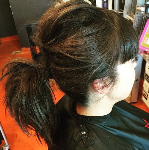 Messy pony for medium hair with bangs