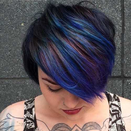 Short choppy haircut with blue highlights