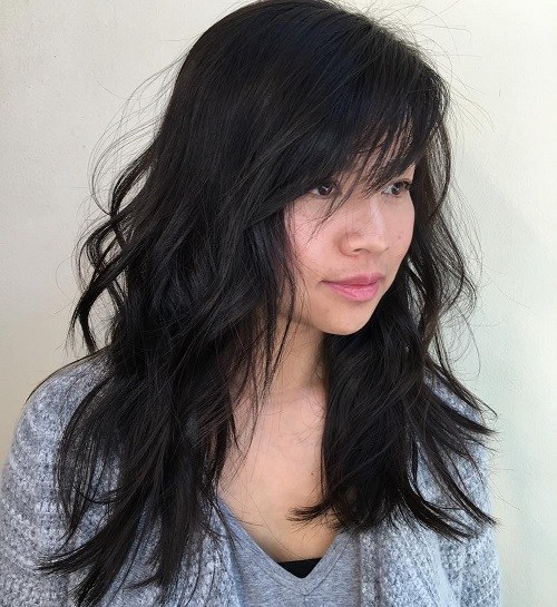 Tousled hairstyle with side bangs