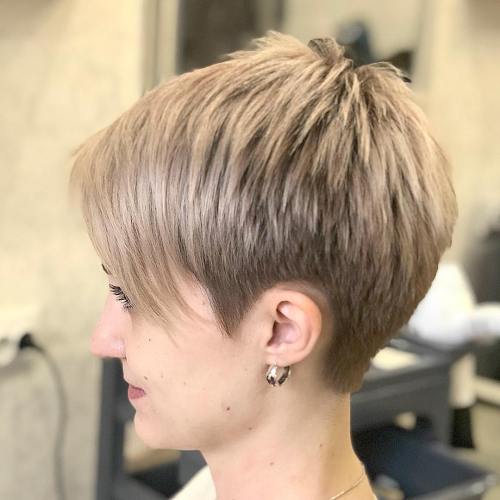 Short piecey blonde pixie with bangs
