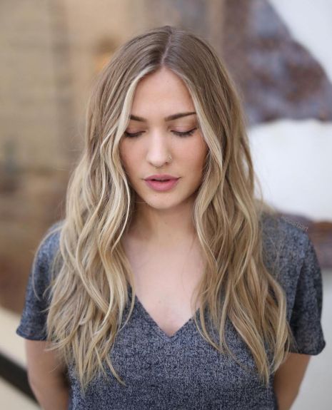 Centreparted beach waves hairstyle