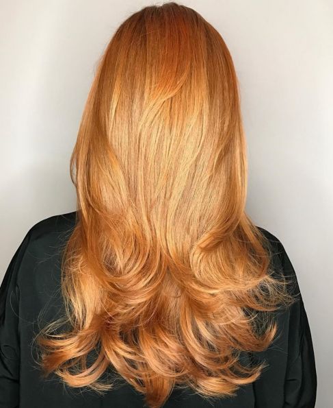Long strawberry blonde hairstyle with layers
