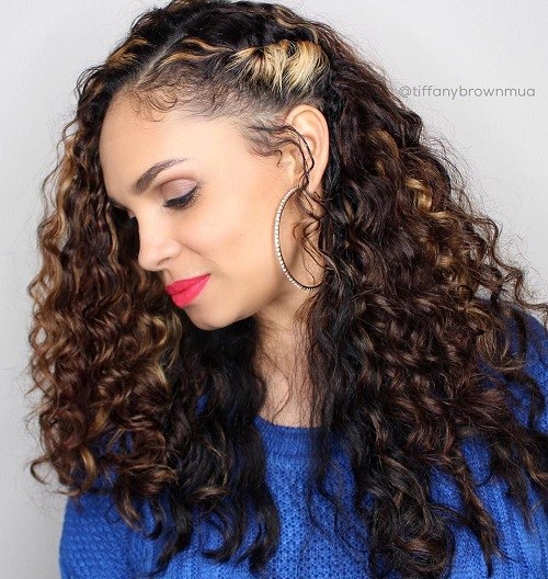 Side pinned long curly hairstyle