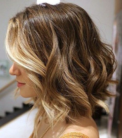 medium Curly Hairstyle with Blonde Face Framing