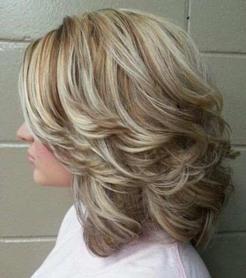 Medium curly hairstyles with highlights and back swept layers