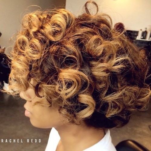 Short curly black hairstyle with highlights