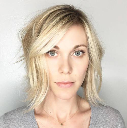Blonde tousled bob with side bangs