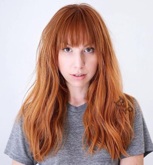 Long layered copper red hair with bangs