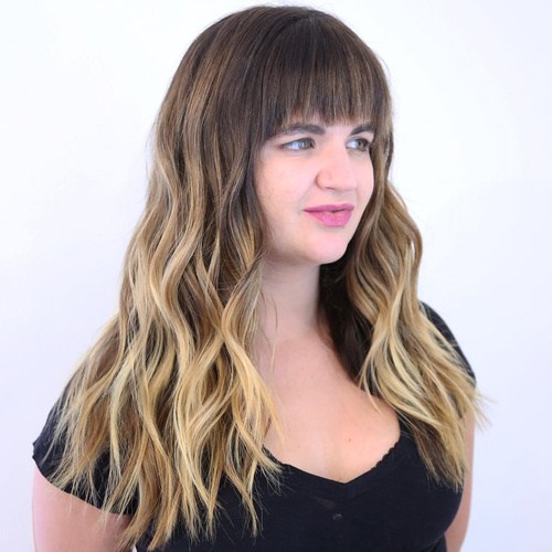 Long wavy hairstyle with straight bangs