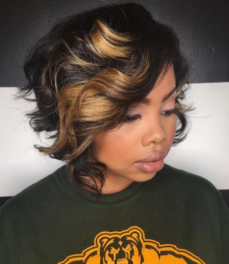 Black curly bob with chunky highlights