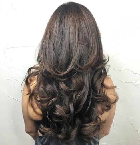 Brunette layered curly hairstyle long hair