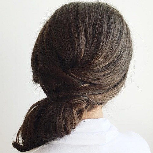 Brunette side ponytail with a criss cross detail