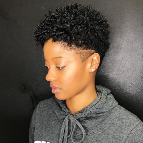 Short twist out hairstyle with shaved temples