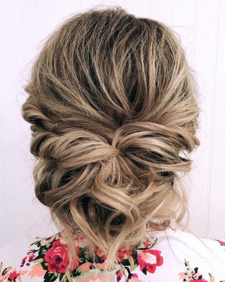Twisted and pinned low updo for prom