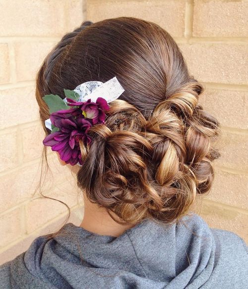 low curly updo with flowers