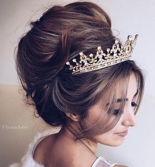 messy beehive wedding updo with tiara