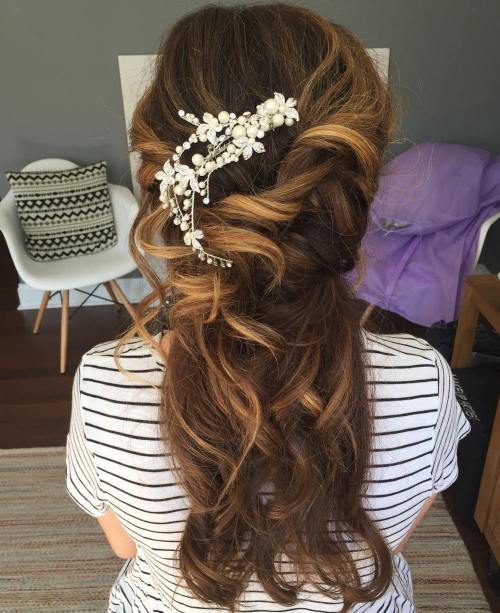 messy curly bridal half up hairstyle