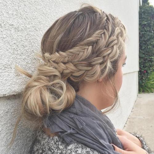 Two side braids with a low knot