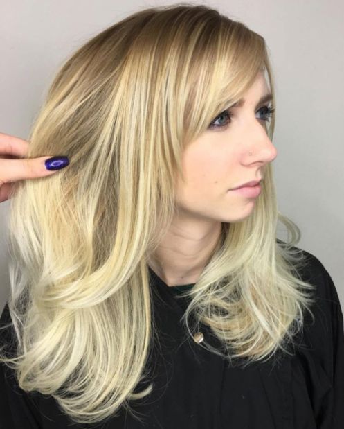 Long layered blonde hairstyle with Lowlights