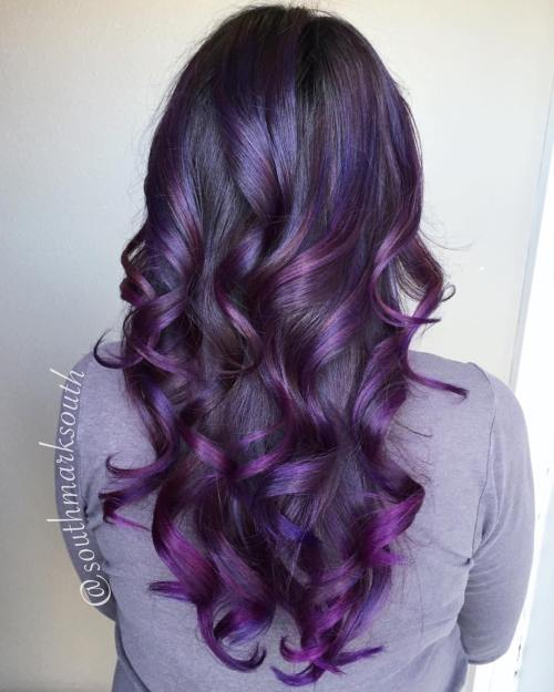 Curled black with purple balayage hair