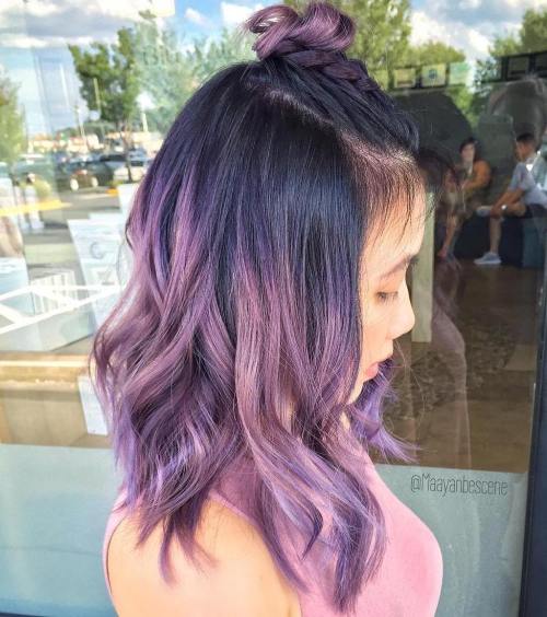 Pastel purple hair with black roots