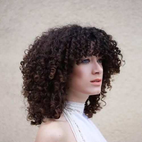 Medium layered curly hairstyle