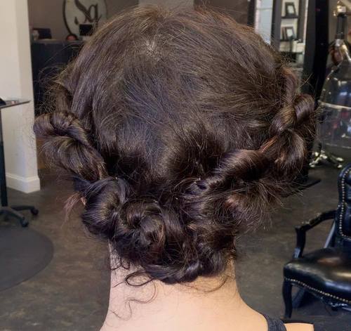 Messy knotted roll updo