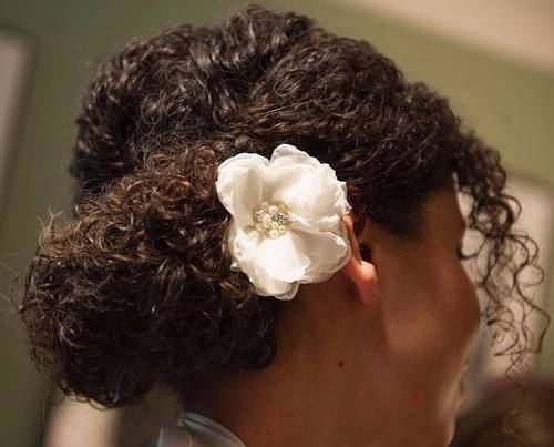 Updo for natural hair with a flower