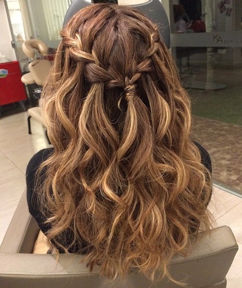 Braided curly half updo for long hair