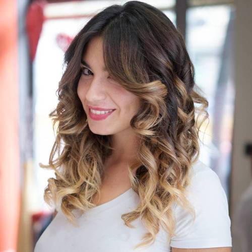 Long curly hairstyle with ombre highlights