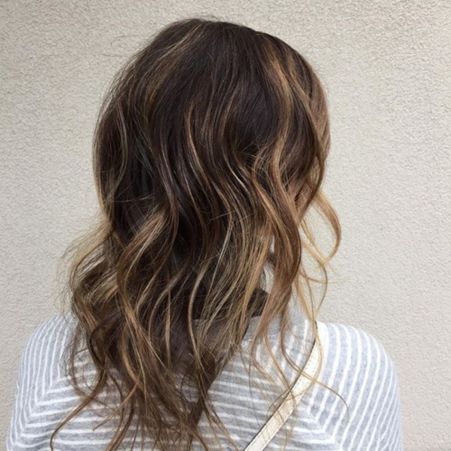 Medium wavy hairstyle with highlights
